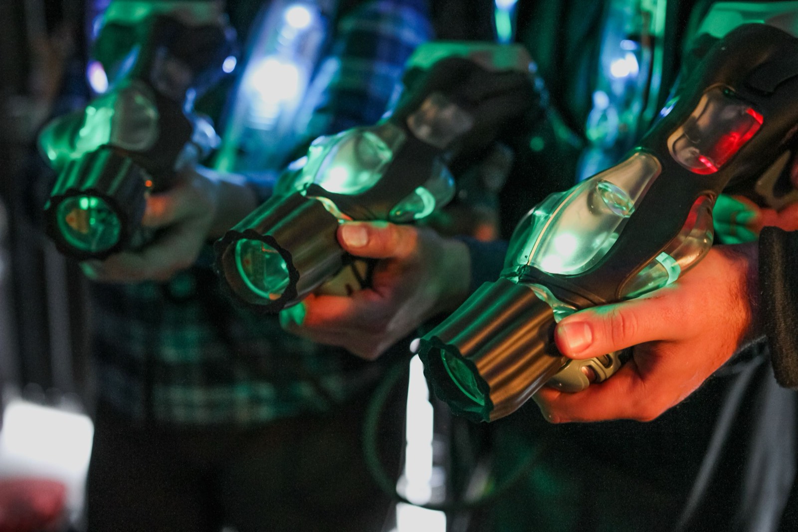 Players in a neon-lit laser tag arena