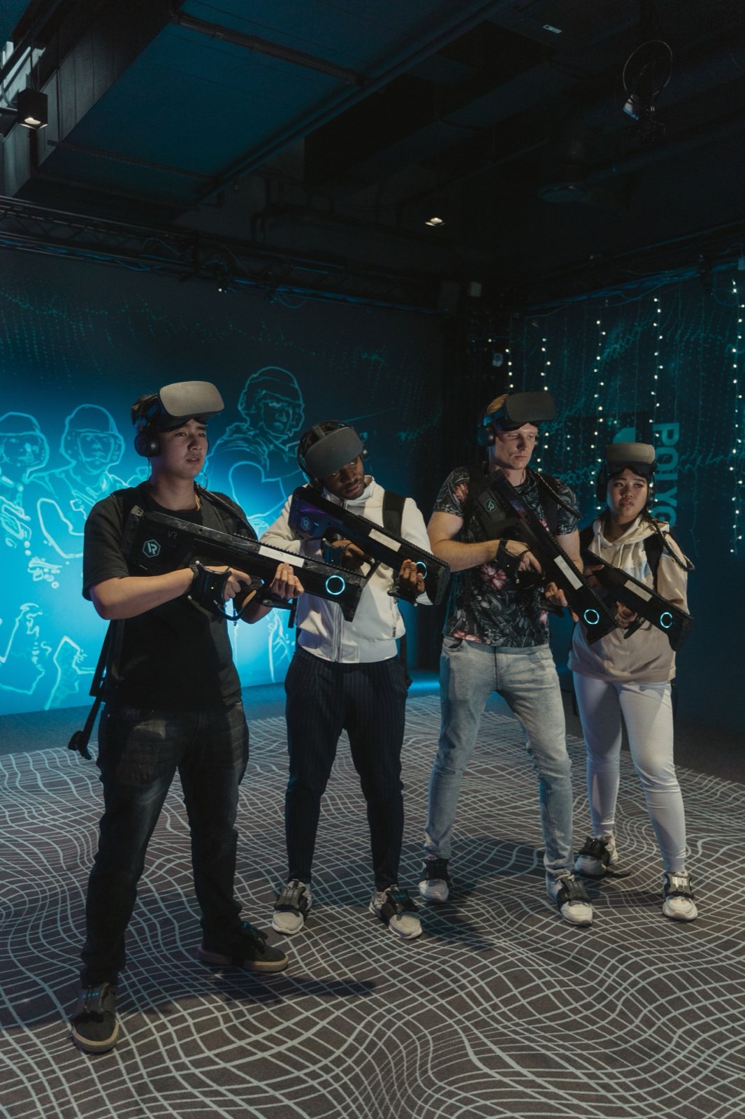 Friends wearing VR headsets in the VR arena